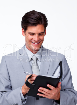 Smiling businessman holding an agenda