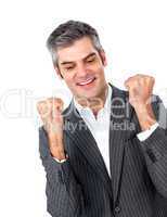 Mature businessman punching the air in celebration