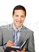 Smiling businessman holding an agenda