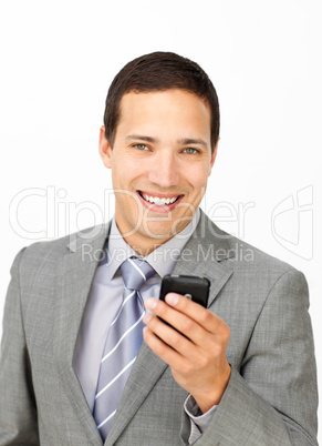 Attractive businessman sending a text