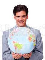 Self-assured businessman holding a terrestrial globe