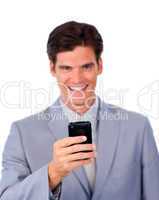 Smiling businessman using a mobile phone