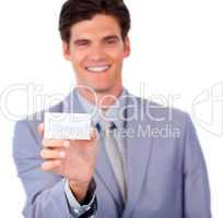 Positive businessman holding a white card