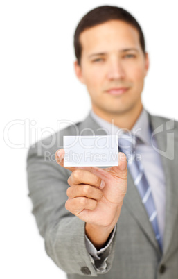 Composed young businessman holding a white card