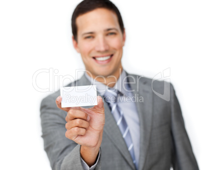 Smiling young businessman holding a white card