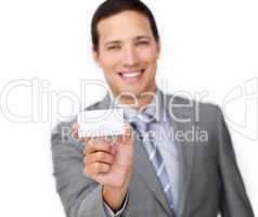 Smiling young businessman holding a white card