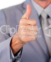 Close-up of a businessman with thumb up