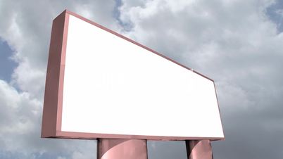 Blank billboard against sky time lapse