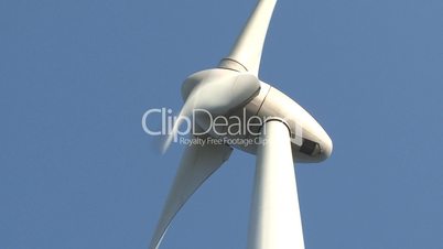 Wind power turbine on blue sky