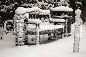 bench covered in snow