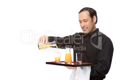 Waiter pouring juice