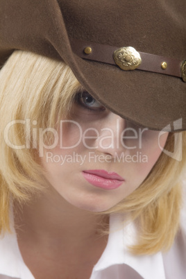 cowgirl in brown hat close-up