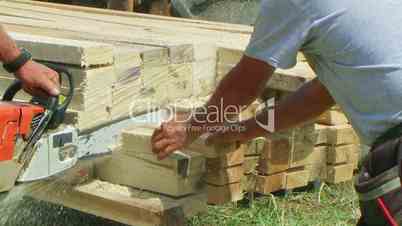 Chainsaw Cutting Lumber