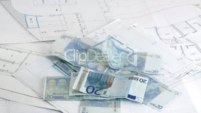 Money for house euro banknotes over house plans