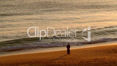 Couple in love on the beach at sunset