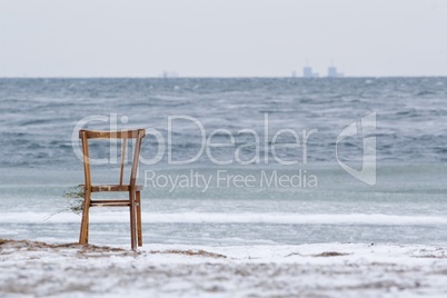 Chair washed ashore and Barsebäck in the background