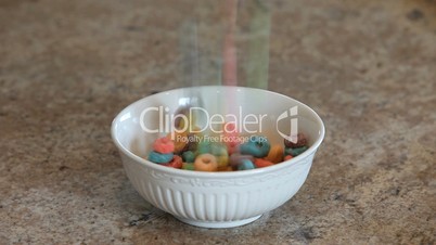 Cereal bright loops into bowl close slow