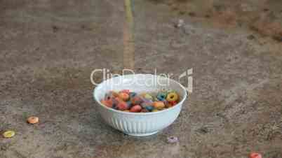 Cereal colored loops pour into bowl