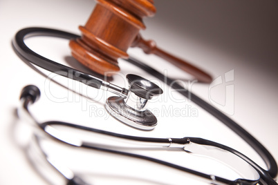 Gavel and Stethoscope on Gradated Background