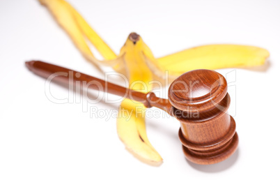 Gavel and Banana Peel on Gradated Background