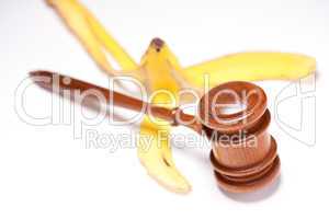Gavel and Banana Peel on Gradated Background