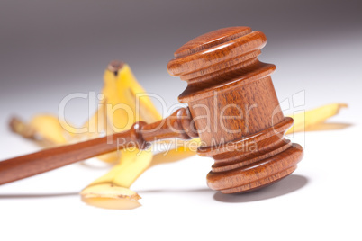 Gavel and Banana Peel on Gradated Background