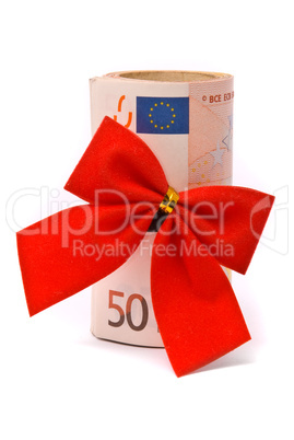 Roll of Euro money and red bow isolated on white background