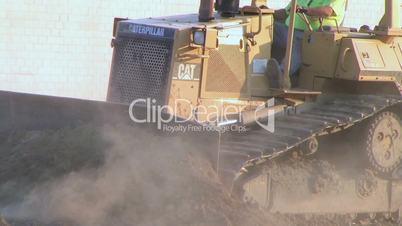 Dozer Clears Edge of Road