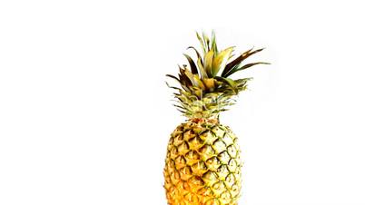 Close up of rotating pineapple , loopable