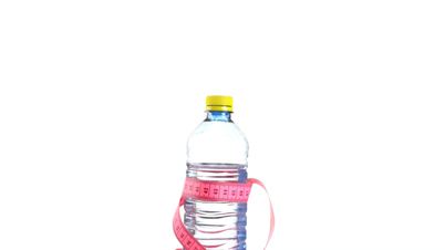 Bottle of water with tape measure rotates , loopable