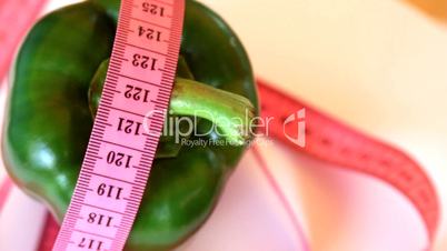 Green pepper with tape measure rotates , loopable