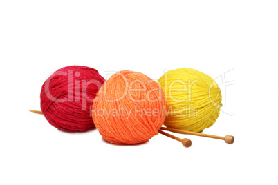 Colorful yarn balls over white