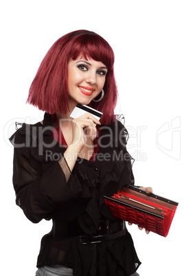 Happy woman holding credit card and wallet