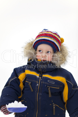 child with shovel look up in winter background
