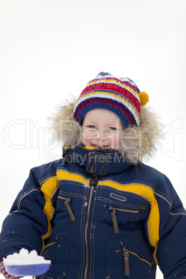 child with shovel look at you in winter background