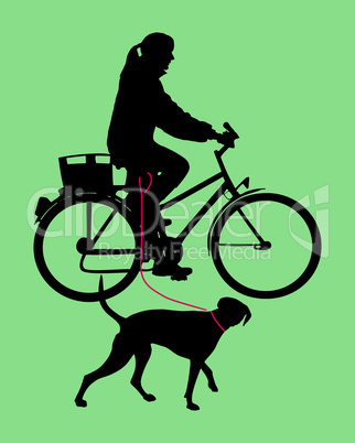 Radfahrerin mit Hund an der Leine