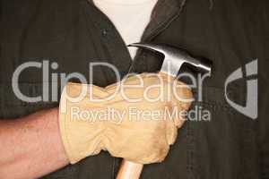 Man with Leather Construction Glove Holding Hammer