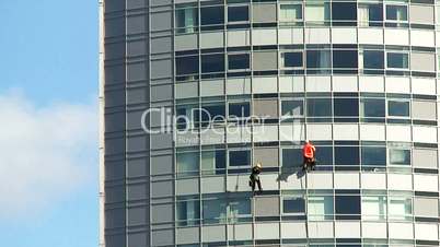 Cleaning windows on a high rise office building.