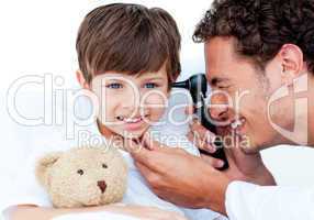 Attractive doctor examining patient's ears