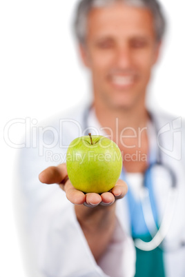 Doctor presenting a green apple