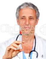 Self-assured doctor presenting a syringe