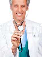 Attractive doctor presenting his stethoscope