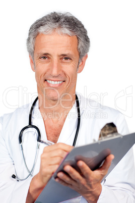 Smiling doctor writting documents