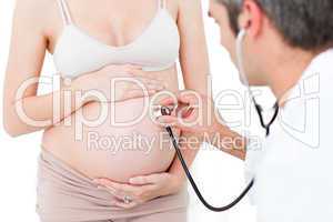 Gynecologist examining a pregnant woman