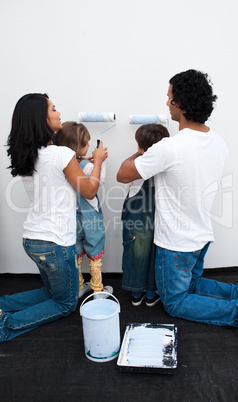 parents helping their children paint