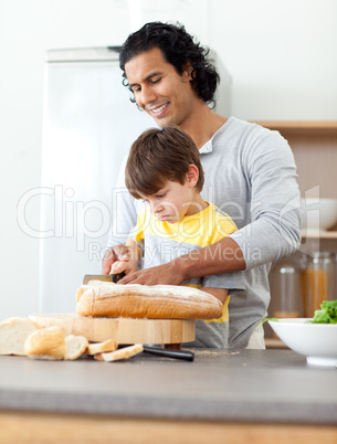 father cutting bread with his son