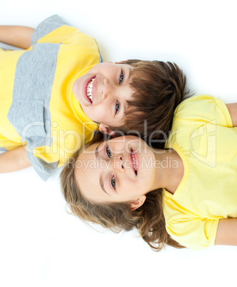 Adorable children lying on the floor