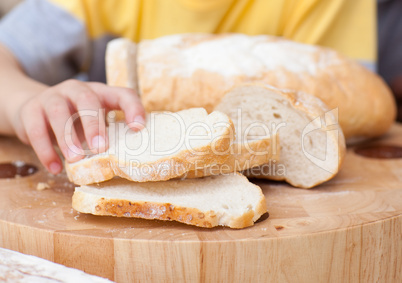 child taking some bread