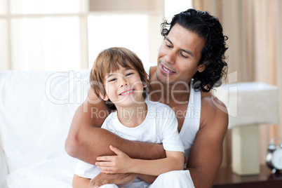 Cute little boy having fun with his father