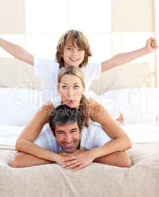 Cute child and his parents having fun